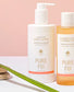 Collection of Pure Fiji skincare products on a light pink background